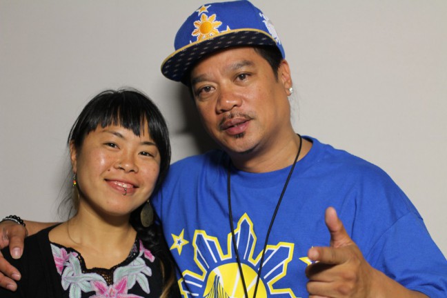 Geraldine Ah-Sue and Rudy Corpuz, Jr. chat in the StoryCorps booth.
