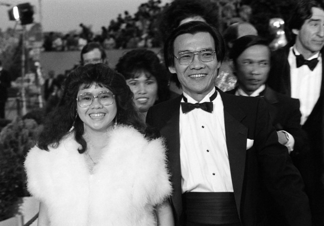 Dr. Haing S. Ngor, right, accompanied by his niece Sophia Ngor, arrives at the 57th Annual Academy Awards® in Los Angeles, Calif., March 25, 1985. Ngor won the Best Supporting Actor Oscar® for his portrayal of a Cambodian refugee in the film "The Killing Fields." (AP Photo by Mark Elias).