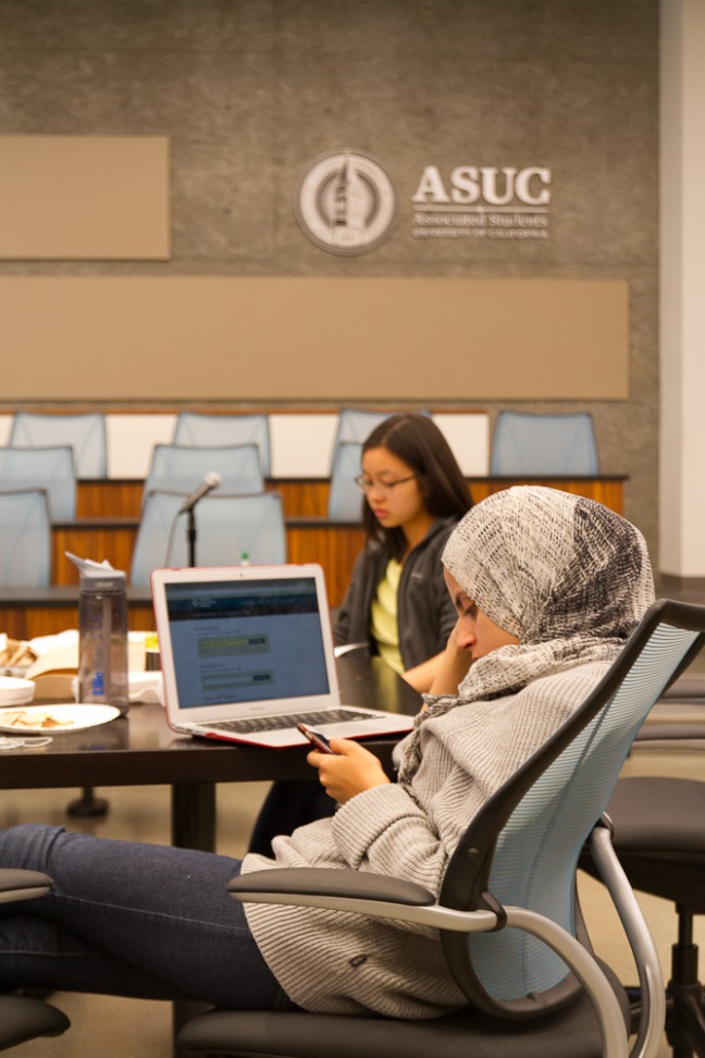 UC Berkeley student Alaa Aissi studies California voter initiatives. Aissi said she does not identify as Asian American, but was there to learn about how issues face communities of color. Photo by Grace Hwang Lynch.