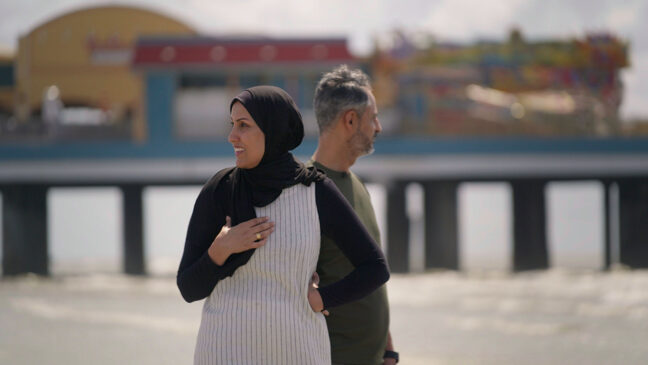 man and woman looking from a far on a beach