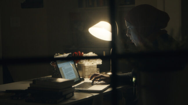 woman typing in her laptop